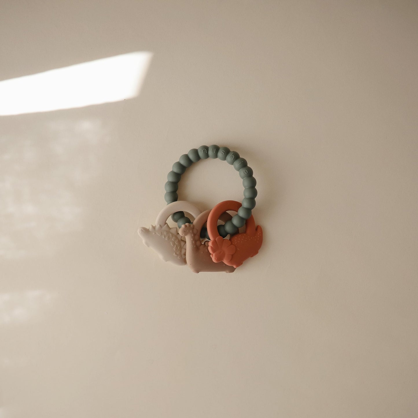 mushie Silicone Dino Teething Ring Toy