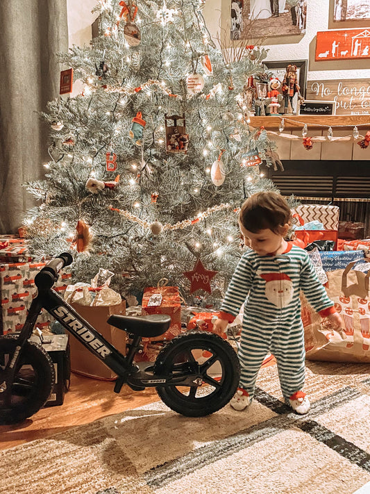 Strider 12” Sport Bike, Black - No Pedal Balance Bicycle for Kids 1 to 4 Years - Includes Safety Pad, Padded Seat, Mini Grips & Flat-Free Tires - Tool-Free Assembly & Adjustments